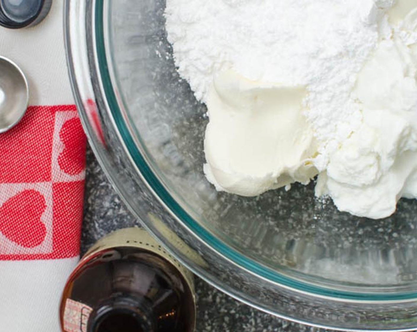 step 3 In a medium bowl, combine the Mascarpone Cheese (1 cup), Greek Yogurt (1/2 cup), Powdered Confectioners Sugar (1/2 cup), and Almond Extract (1 tsp).