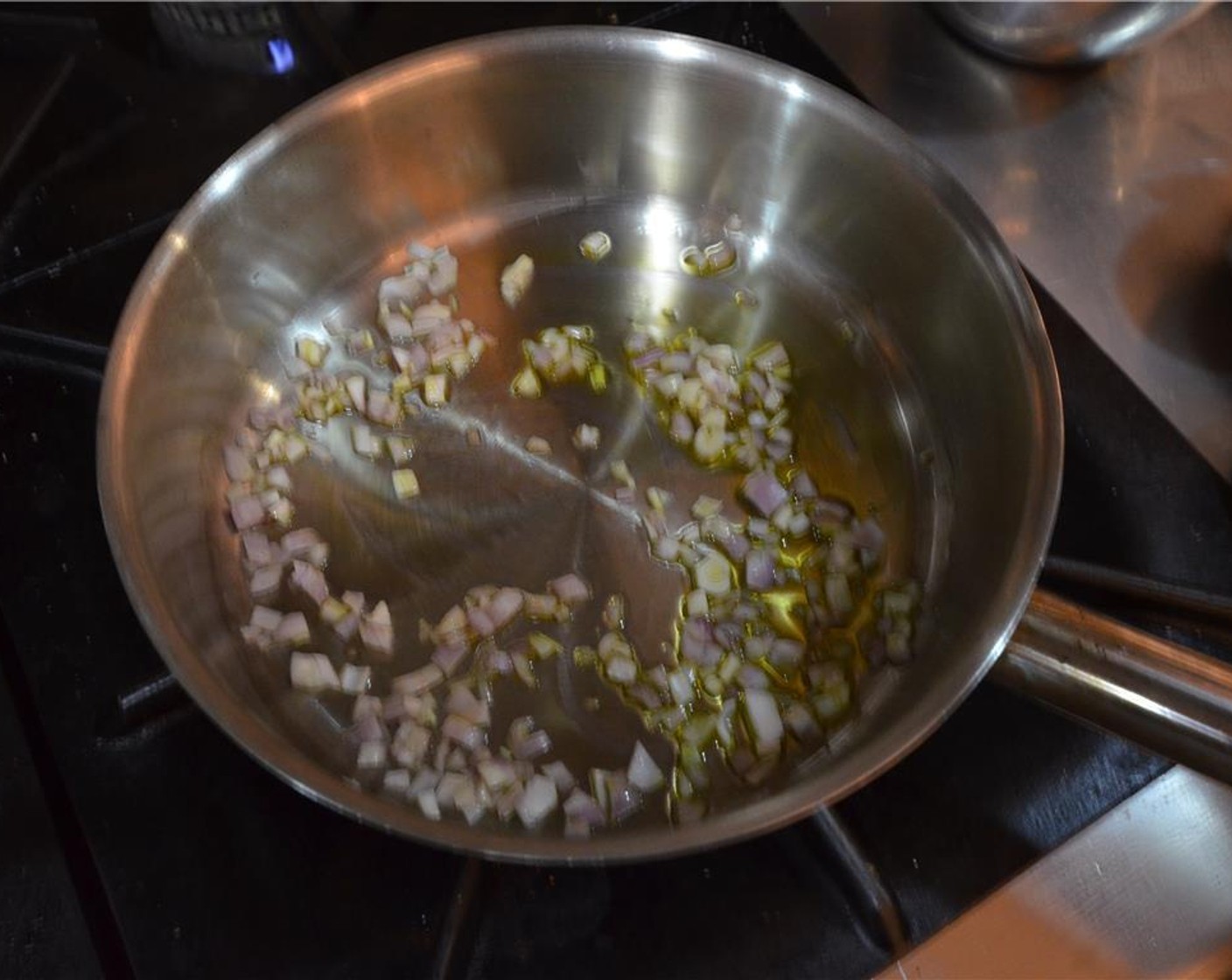 step 4 In a stainless steel sauté pan placed over low heat, sweat the Shallots (2 Tbsp) in Extra-Virgin Olive Oil (as needed) until tender.