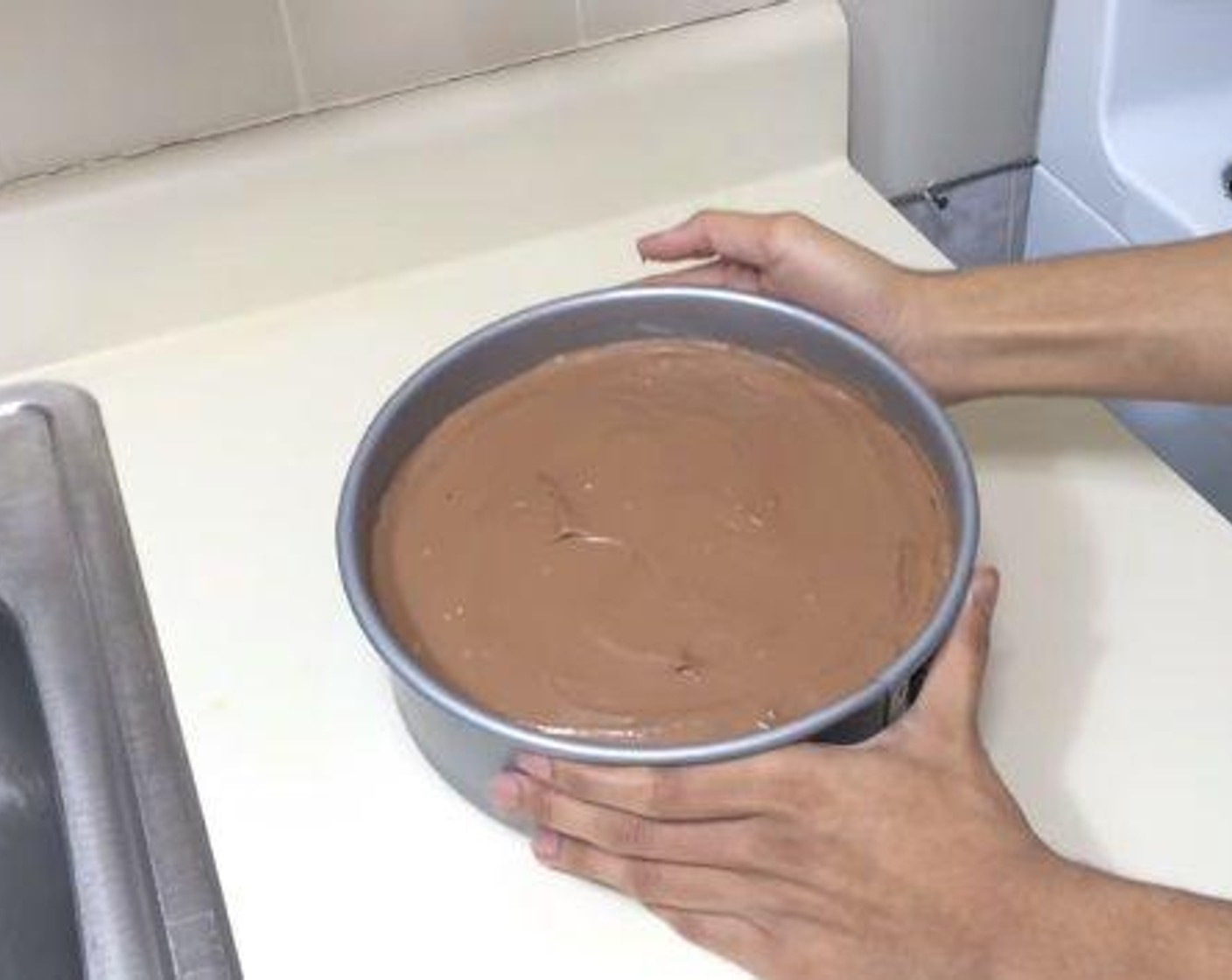 step 5 Into the cream mixture you set aside, add in the Nutella® (1 cup), and mix it well. The pour the mixture over the Oreo base. Chill in the fridge for about 8 hours