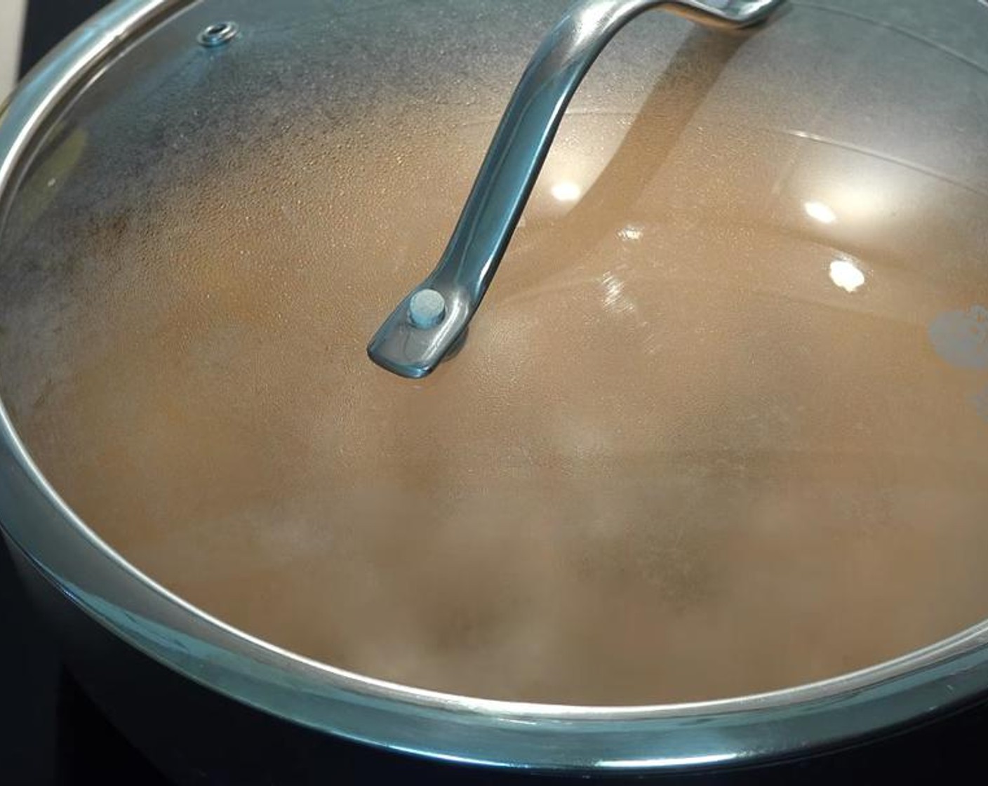 step 6 Once boiling, reduce heat to lowest setting. Place top on the pot and allow to simmer for 45 minutes.
