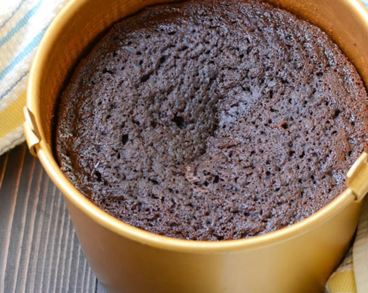 step 6 Pour the batter into the prepared cake pan and secure with the cake pan lid or tent loosely with tin foil vented with small slits. Place the crock pot lid on the crock pot and "bake" for 2 1/2-3 1/2 hours until cake tester comes out clean.