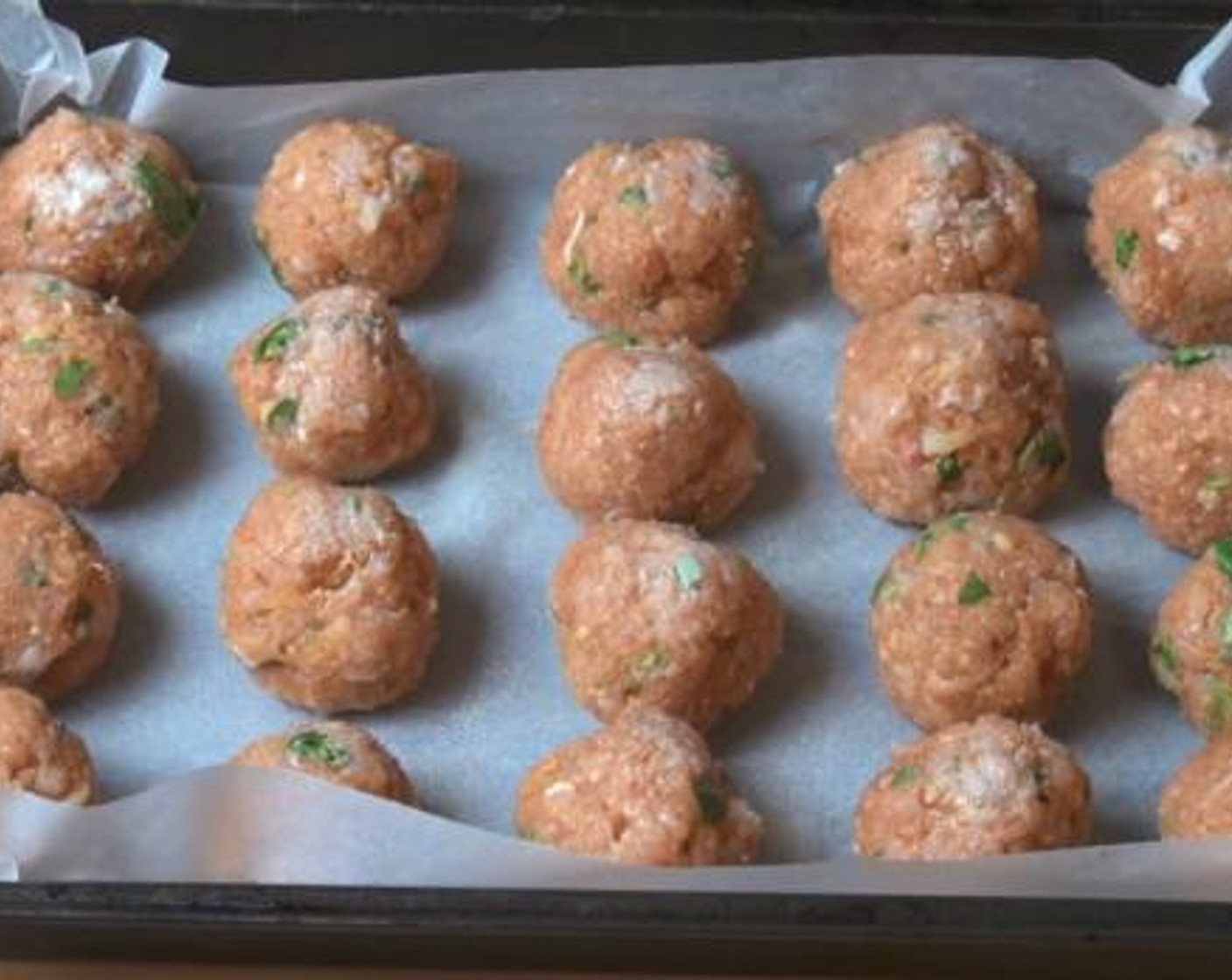 step 3 Take a tablespoon of the mixture, and roll it into a ball shape. Continue with the rest of the meat mixture. Line the balls on a baking tray lined with some baking paper, and bake under 200 degrees C (400 degrees F) for about 20 minutes.