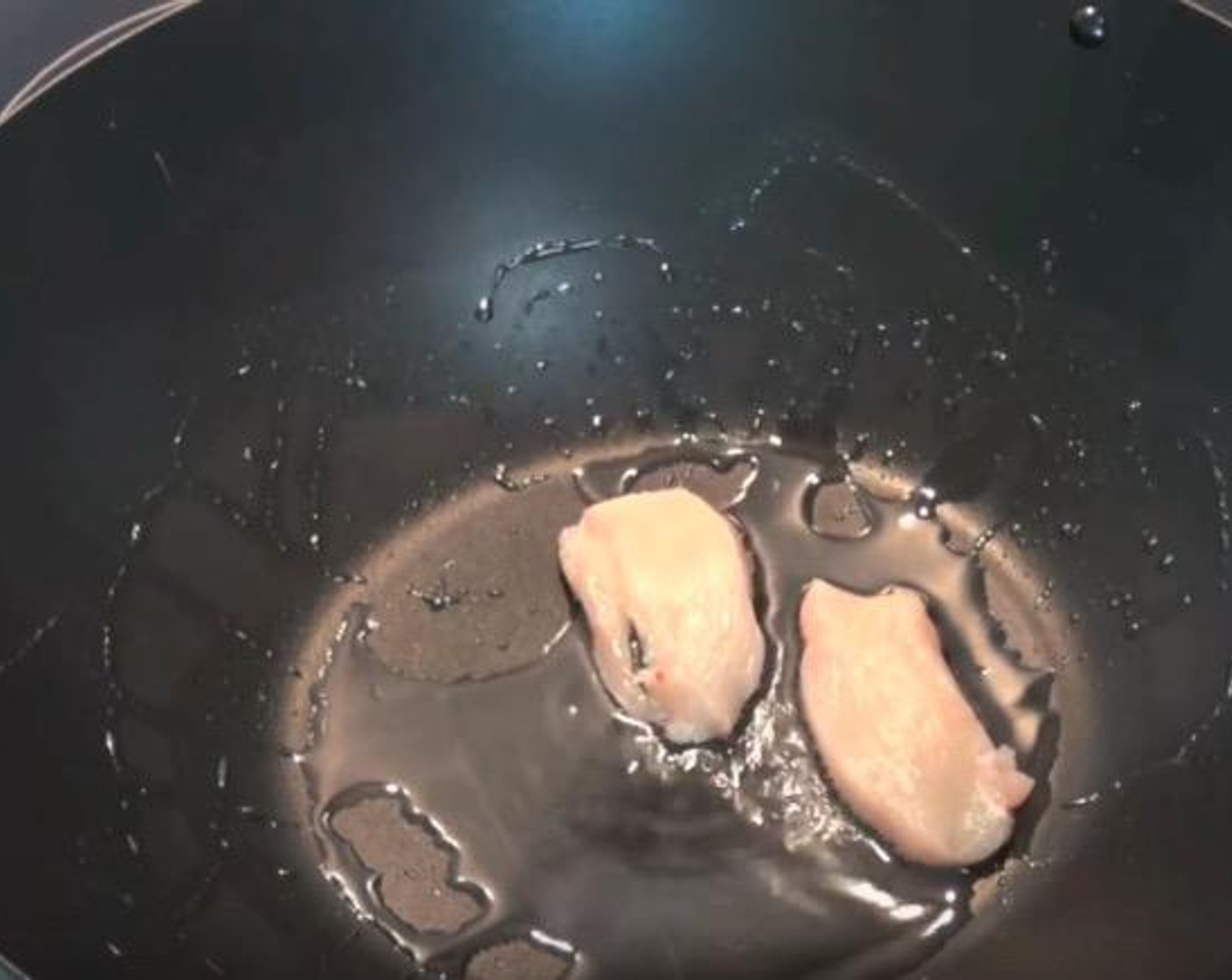 step 3 In a wok or fry pan over high heat, add Vegetable Oil (1 Tbsp). Add Chicken Breasts (1.1 lb). Cook in batches for 4-5 minutes, or until the chicken is just cooked. Transfer to a plate as finished.
