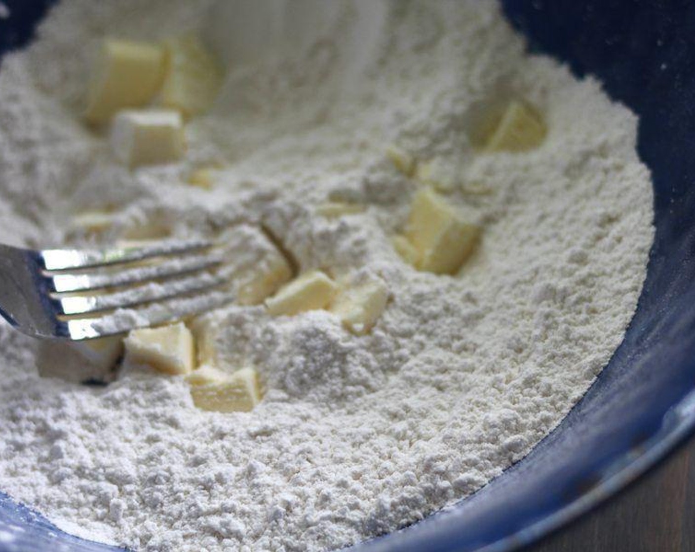 step 6 Using a fork or pastry cutter, cut the Butter (2 Tbsp) into the flour mixture until the mixture has a crumbly texture. Work quickly so the butter does not get soft.