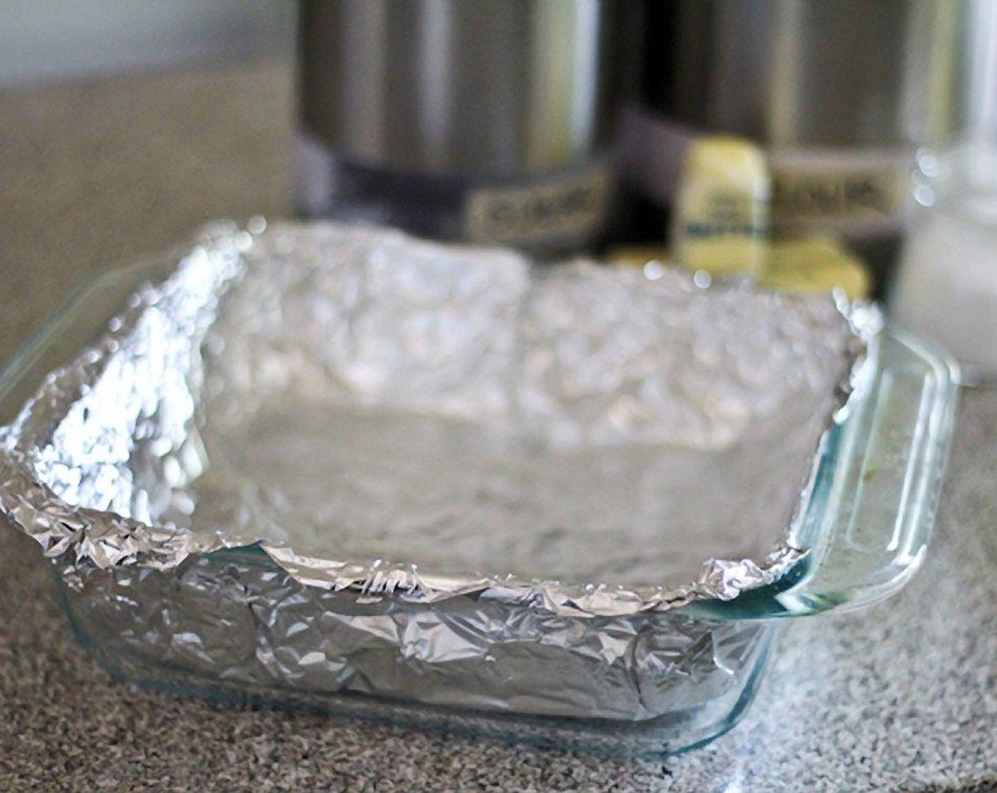 step 2 Line an 8-inch square baking dish with aluminum foil, leaving an overhang.