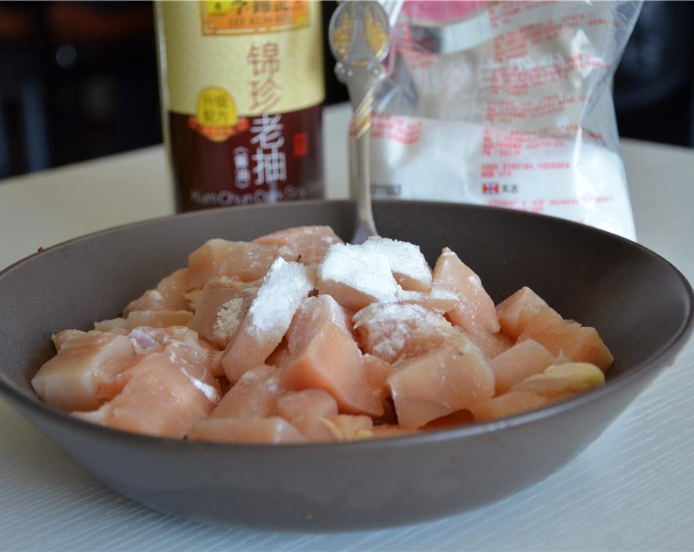 step 4 Marinate the chicken breast with Corn Starch (1 tsp), Salt (1/2 tsp), Granulated Sugar (1 tsp), and Rice Wine (1 Tbsp) for 15 minutes.