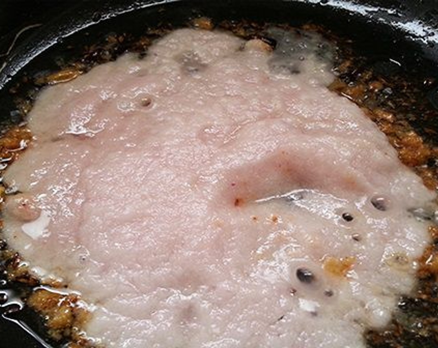 step 7 For the gravy: pour Oil (3 Tbsp) to a kadai. Now add Ground Cumin (1 Tbsp), Bay Leaf (1), Whole Cloves (3) and Black Cardamom (3). Saute for a minute and then add Ginger Garlic Paste (1 tsp). Saute in low flame till the garlic paste starts to become light brown in color. Add the pureed onion. Saute for three to four minutes in medium flame and add Kashmiri Red Chili Powder (1 tsp), Garam Masala (1/2 tsp) and Ground Coriander (1/2 tsp).