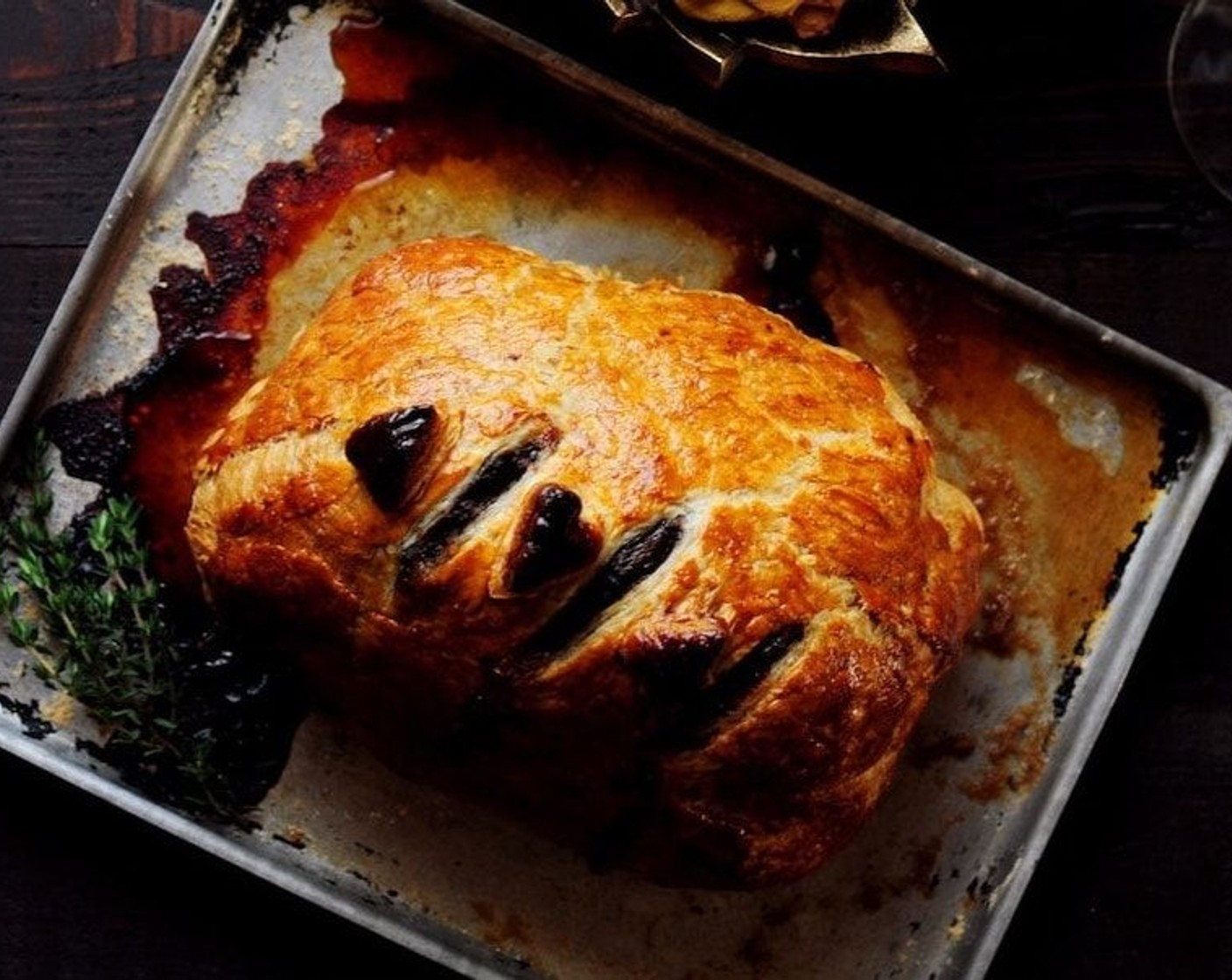 step 14 Transfer Beef Wellington to a carving board. Let stand 10 minutes.