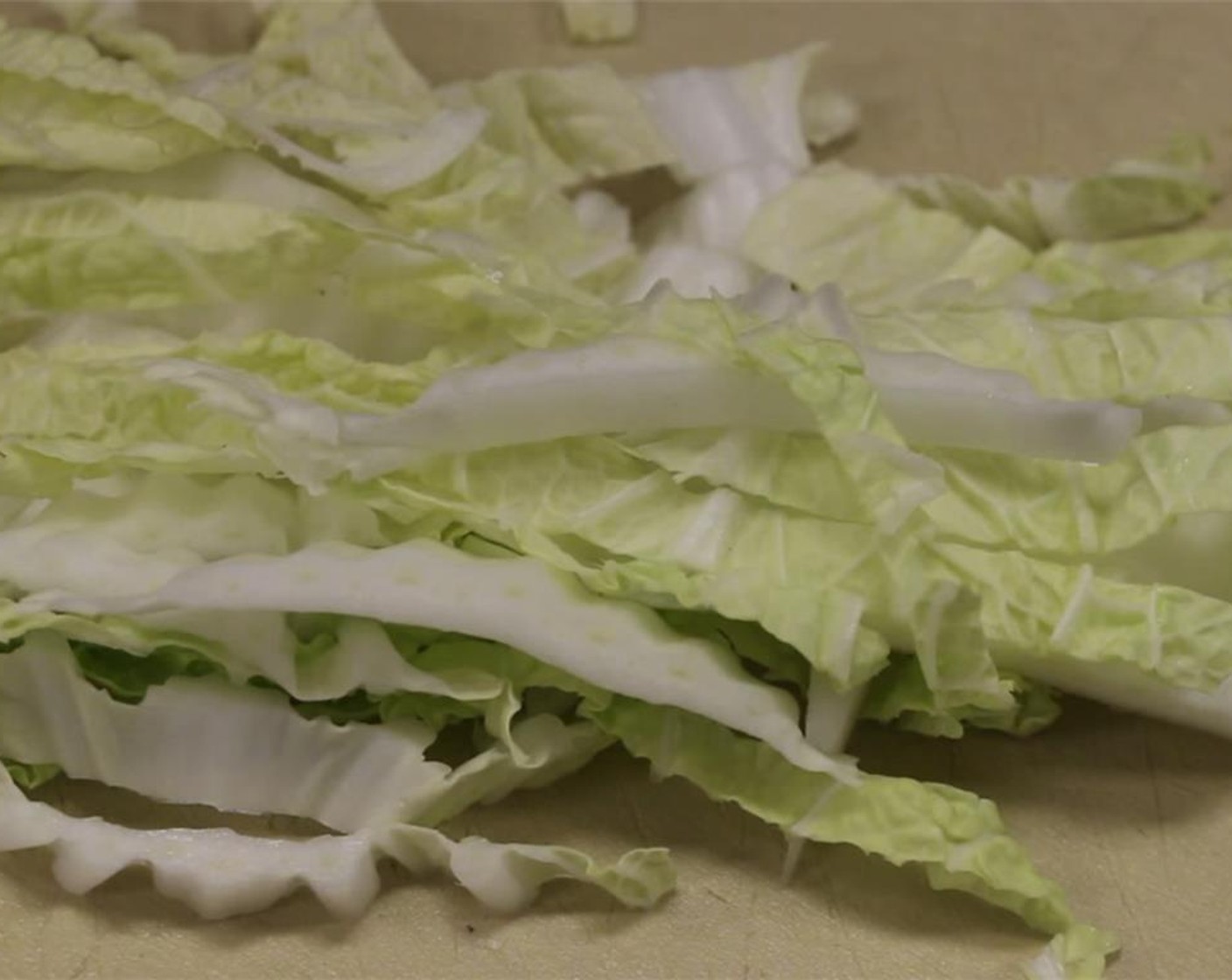 step 4 Cut Napa Cabbage (1/2 cup) into strips.