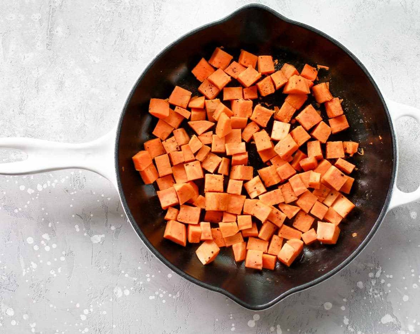 step 3 In the same skillet, add the Sweet Potato (1) and Chicken Broth (1/2 cup). Cover the pan with a lid. This step is very important because it'll help the sweet potato to cook fast.