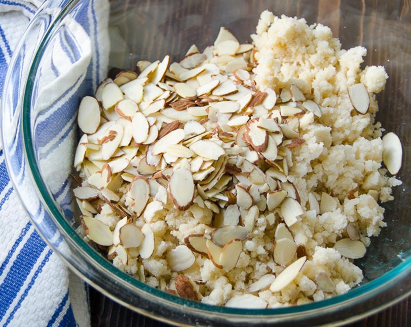 step 3 Transfer to a bowl and with your fingers, work the mixture, squeezing to create a lumpy, crumbly texture. Add the Sliced Almonds (3/4 cup) and toss to combine. Refrigerate until ready to top the crumble.