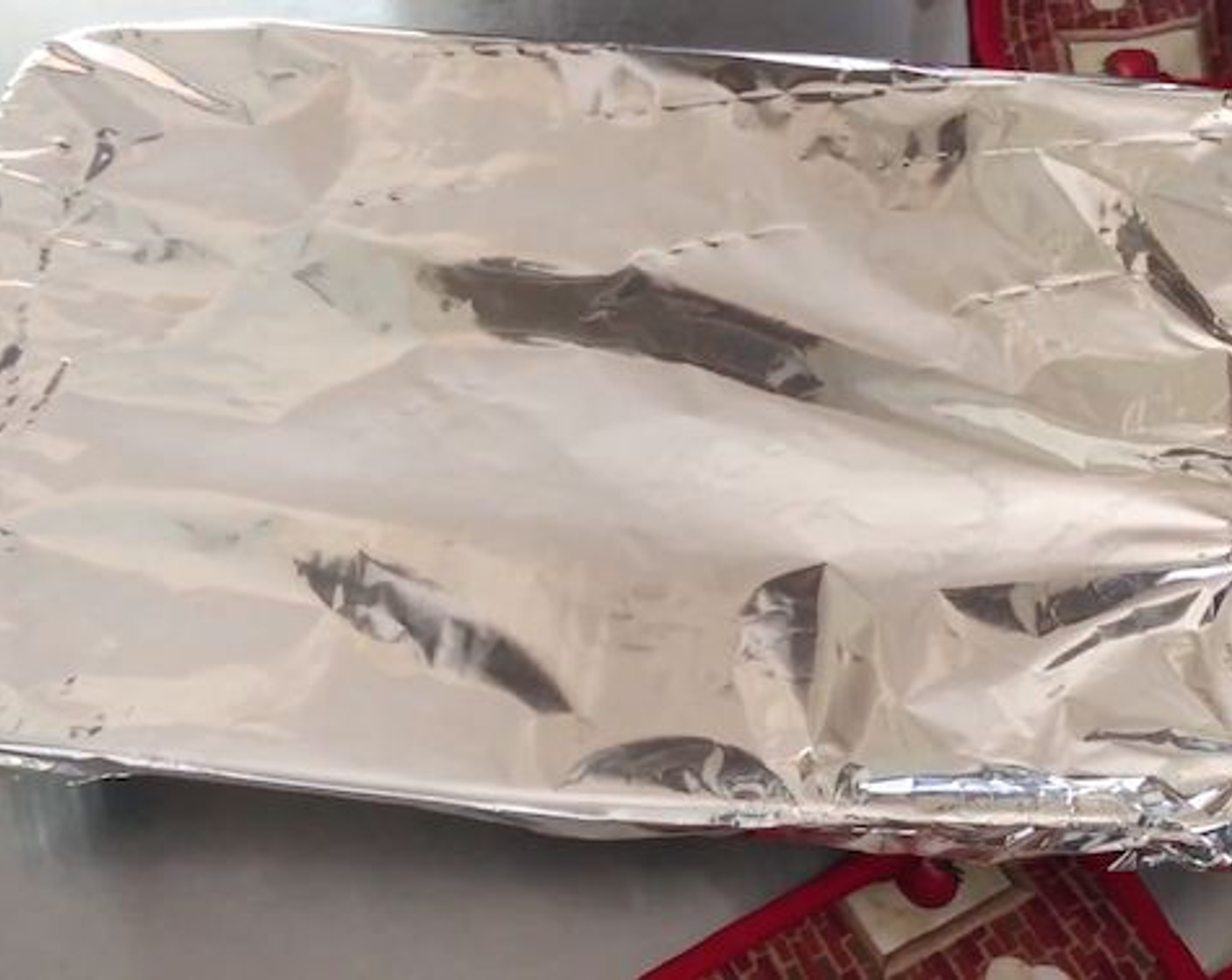step 6 Cover the baking dish with foil and place into your preheated oven to bake for 25 minutes.