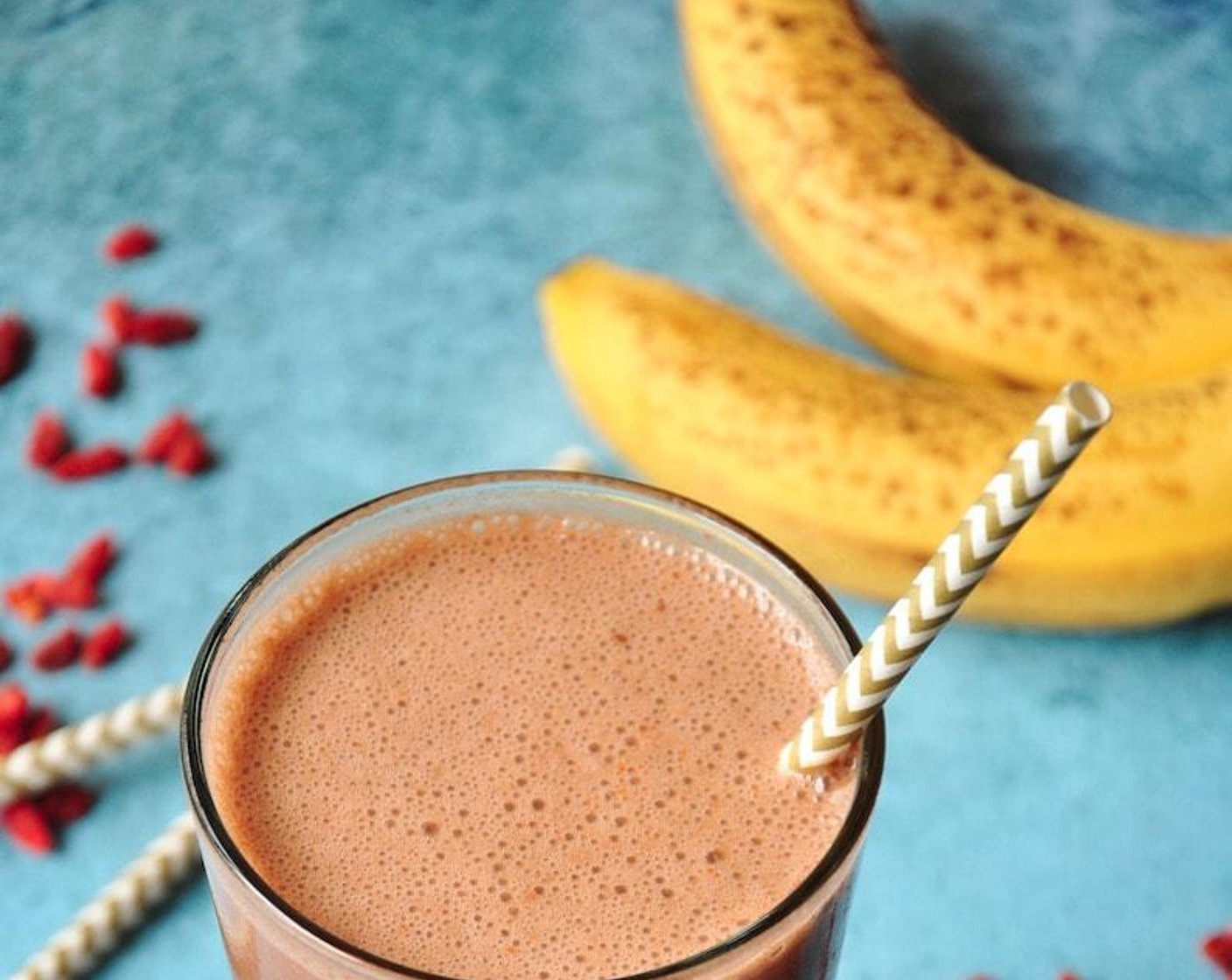 step 1 Add Almond Milk (1 cup) into a blender, followed by the Bananas (1 1/2). Add Greek Yogurt (1/4 cup) and top with Unsweetened Cocoa Powder (1 Tbsp) and Goji Berries (1 Tbsp).