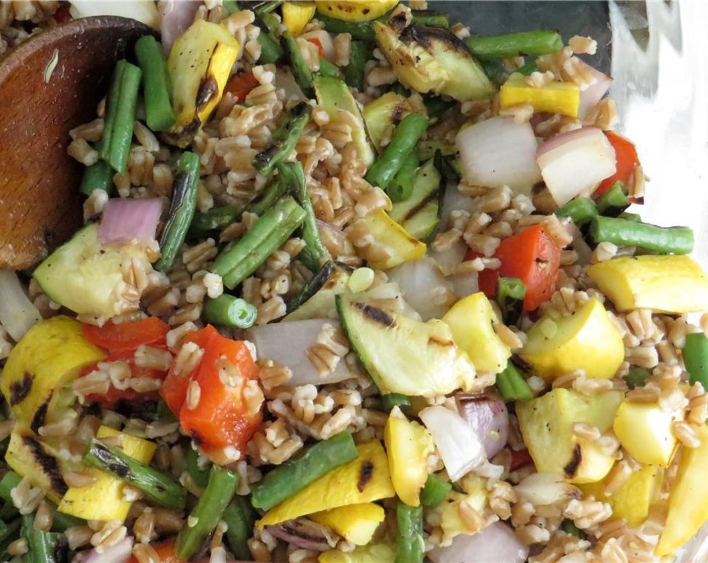 step 6 Cut grilled vegetables into 1/2 inch dice, and transfer to a large bowl. Add farro, yellow cherry tomatoes, olives, scallions, and feta cheese. Toss to combine.