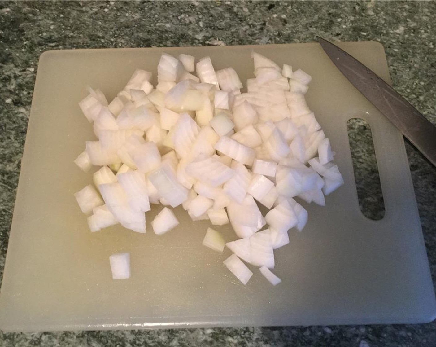 step 7 Peel the White Onion (1) and dice it. Prepare the chopped Garlic (1 clove).
