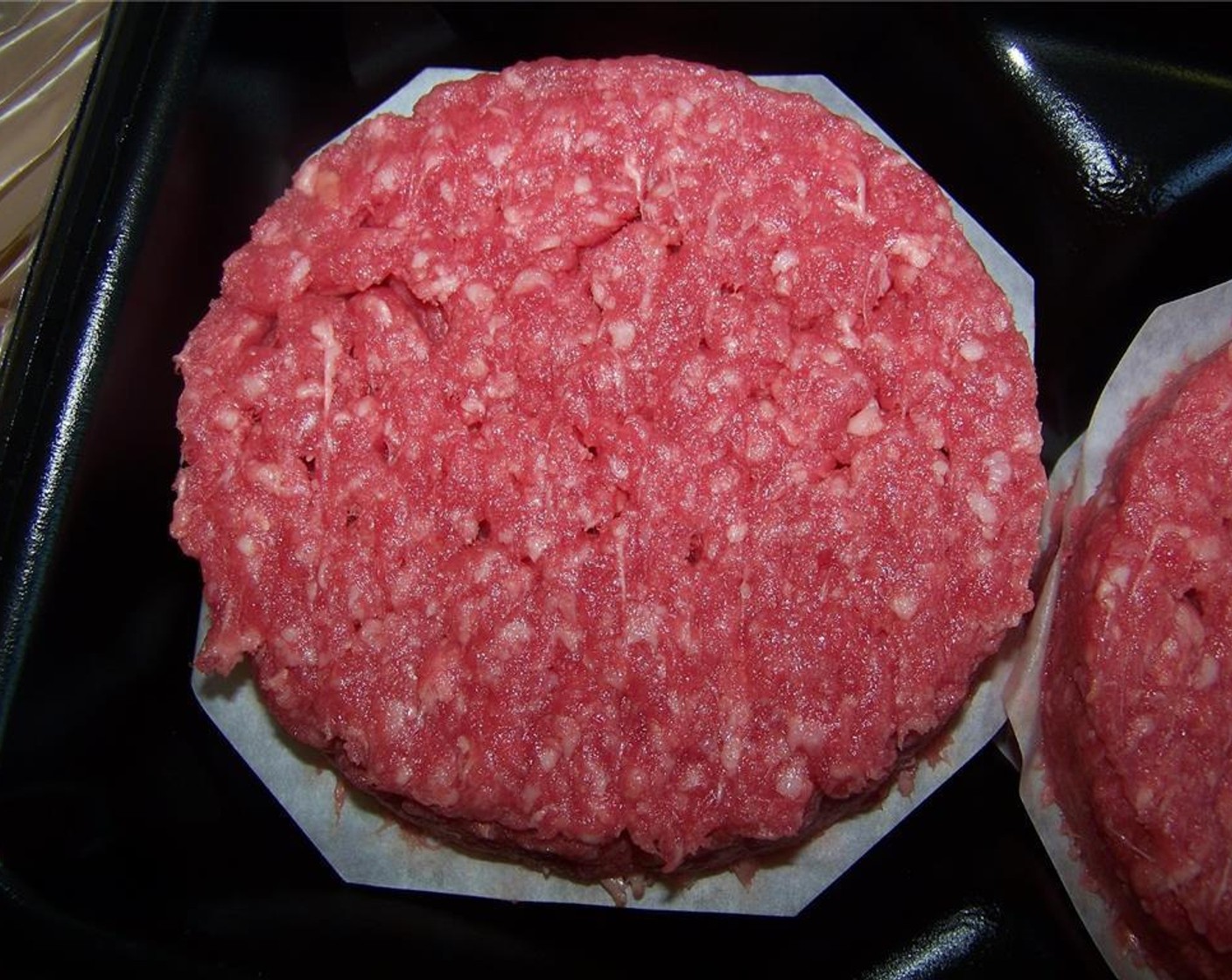 step 6 Divide the Ground Beef (1.5 lb) into four equal portions. Divide each portion into two halves (making the top and bottom of the stuffed burger) and season both sides well with Salt (to taste) and Ground Black Pepper (1/2 tsp)