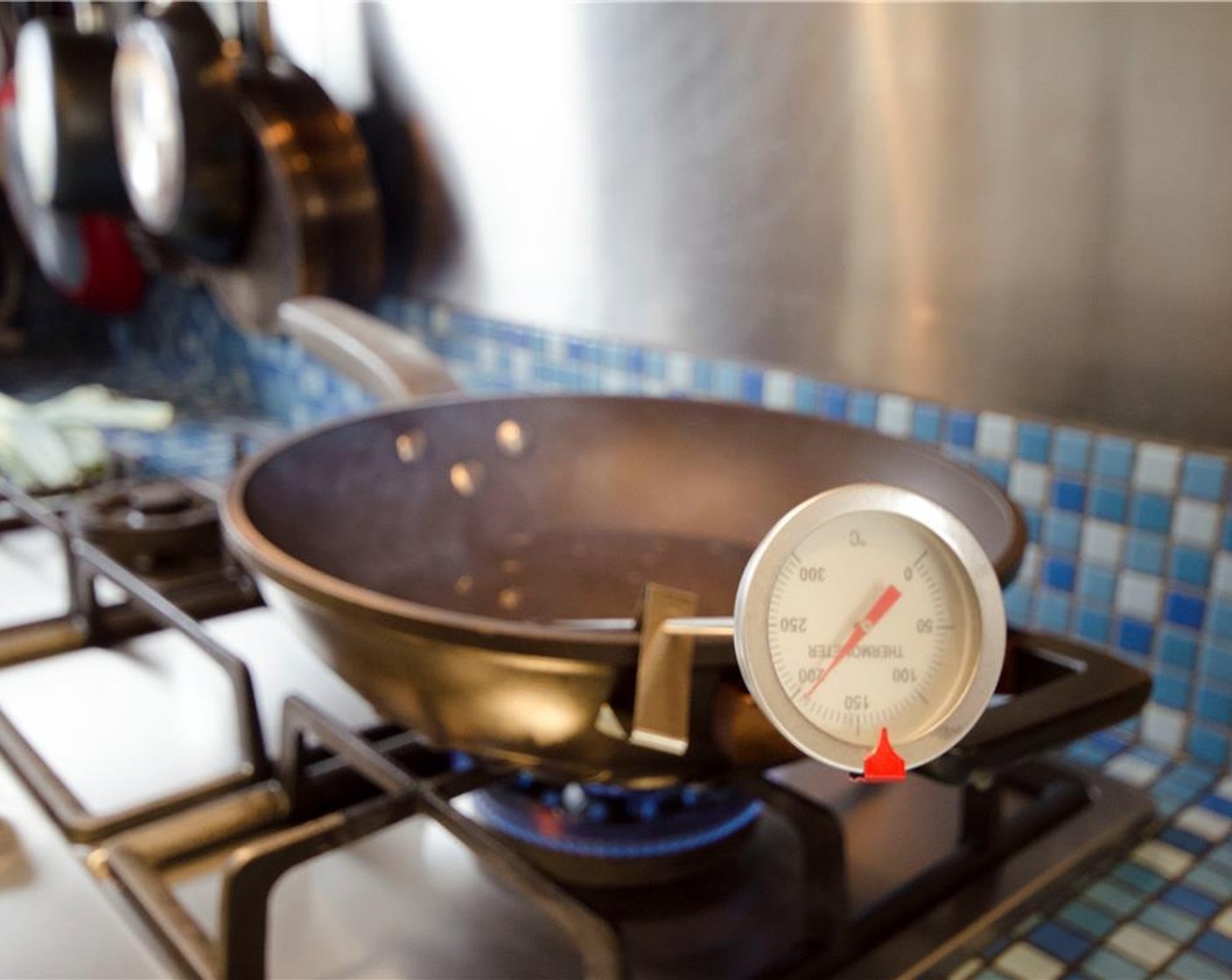 step 10 Heat the Peanut Oil (as needed) to 400 degrees F (200 degrees C) in a large wok or Dutch oven.