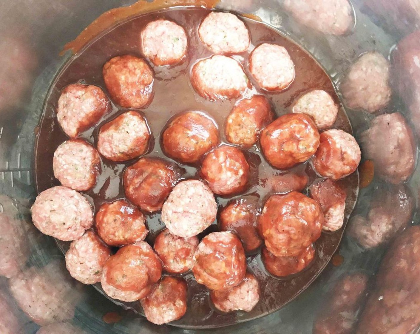 step 4 Transfer the meatballs to the Instant Pot and cover them with the remaining Barbecue Sauce (1 cup) and Guinness® Stout Beer (2 Tbsp).