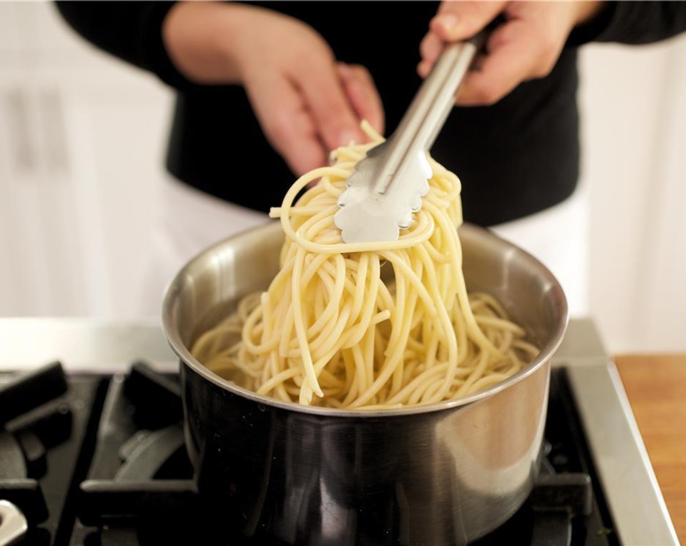 step 5 Test pasta after eight minutes. It should have a bite to it or continue to cook for desired doneness. Drain the pasta into a colander and toss with a little oil to avoid sticking.