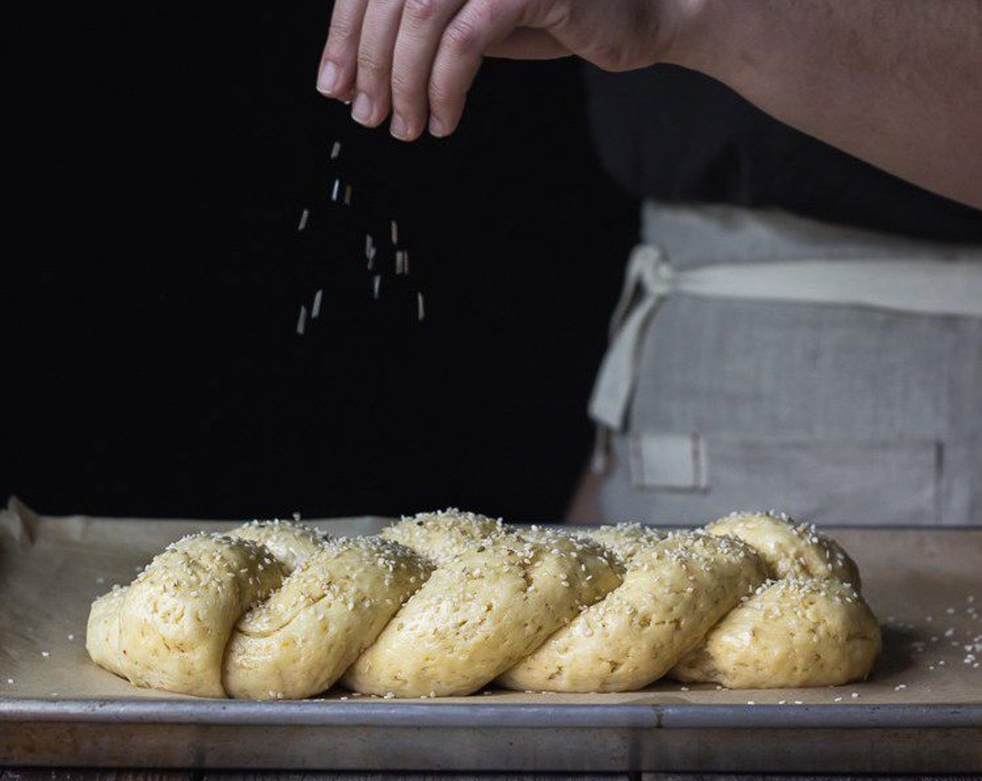 step 21 Brush the loaf again with egg wash, sprinkle with Sesame Seeds (1 Tbsp) and allow to continue to rise uncovered until nearly doubled in size, about another 20 minutes.