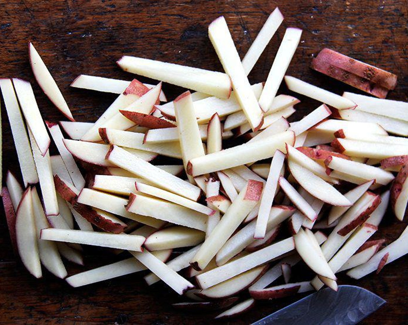 step 1 Wash the Potatoes (2) and cut them, lengthwise, small, even wedges or sticks.