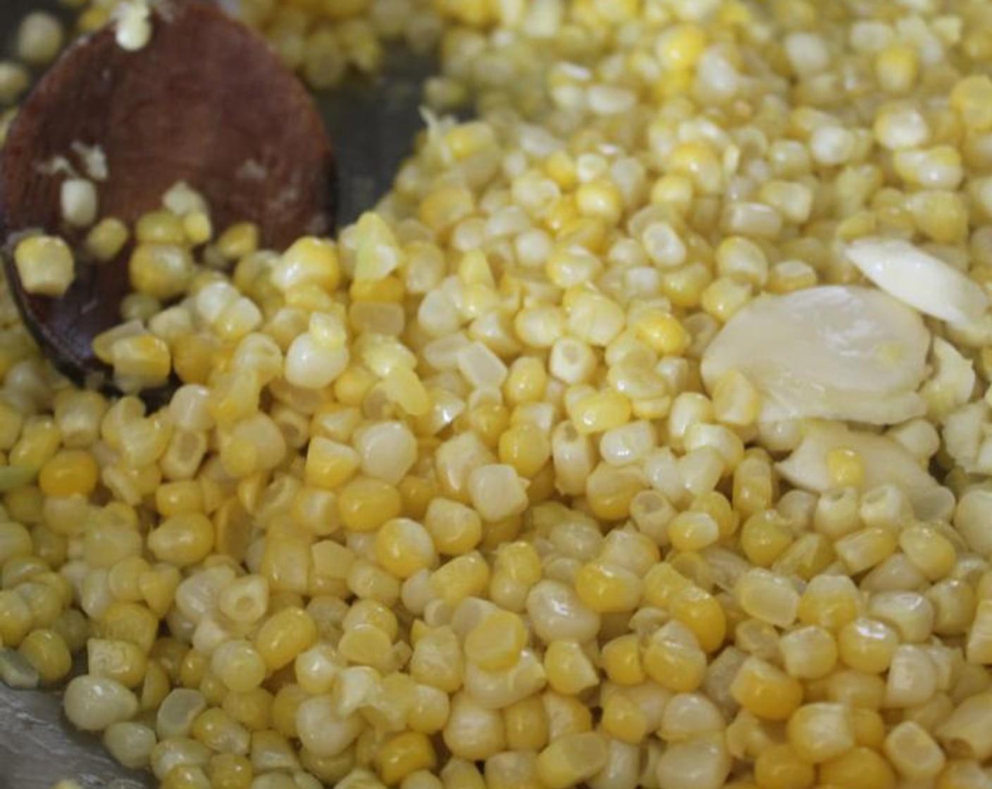 step 2 Add the Corn Kernels (3 1/2 cups), Garlic (2 cloves), and Kosher Salt (1/2 Tbsp) and cook for 8-10 minutes, stirring occasionally, until the corn is tender.