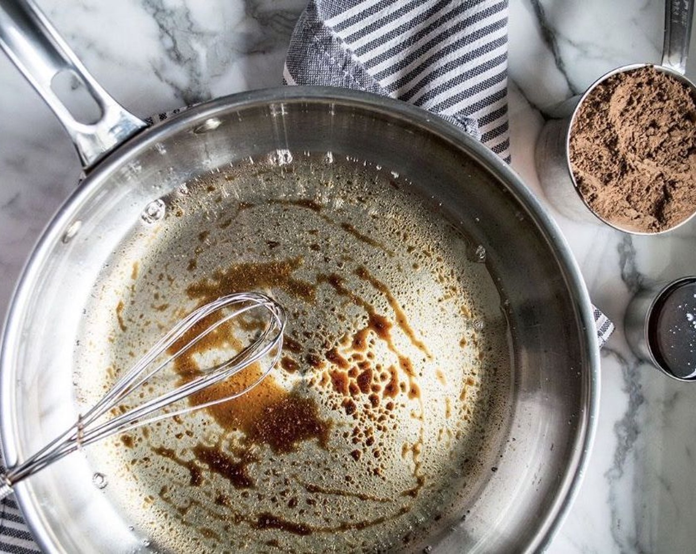 step 1 In a small saute pan, add Refined Coconut Oil (1 cup) and Vanilla Extract (1/2 Tbsp). Melt over medium heat, stirring continuously.