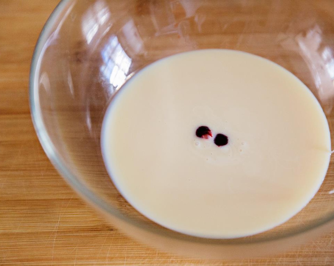 step 1 Divide the Sweetened Condensed Milk (1 1/3 cups) into two bowls. Add the Red Food Coloring (2 dashes) to the one half.