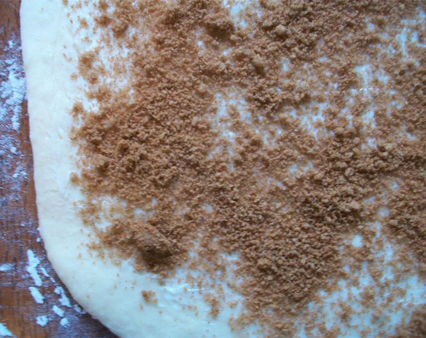 step 6 For the filling: combine Brown Sugar (1/3 cup) and Simply Organic Cinnamon, Ground (2 tsp). Once dough has risen. Roll out on a floured surface to 1/4″ thickness. Spread Butter (2 Tbsp) on top and sprinkle with brown sugar cinnamon.