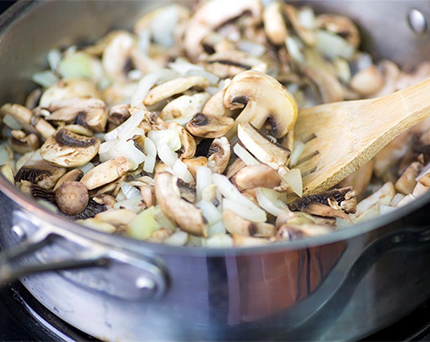 step 6 In large pot over medium heat, melt Butter (1/2 cup). Add the finely chopped Button Mushrooms (4 1/2 cups), finely diced Onion (1) and cook 3 to 4 minutes.