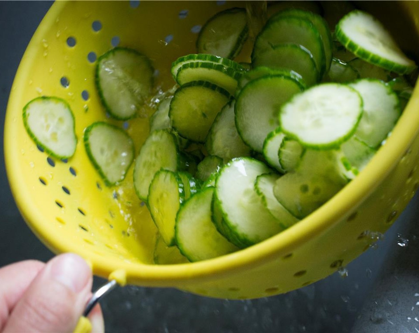 step 4 Rinse the cucumbers well under cold water, making sure to remove all of the excess salt.  Allow to drain in the colander while you work on the vinegar mixture.