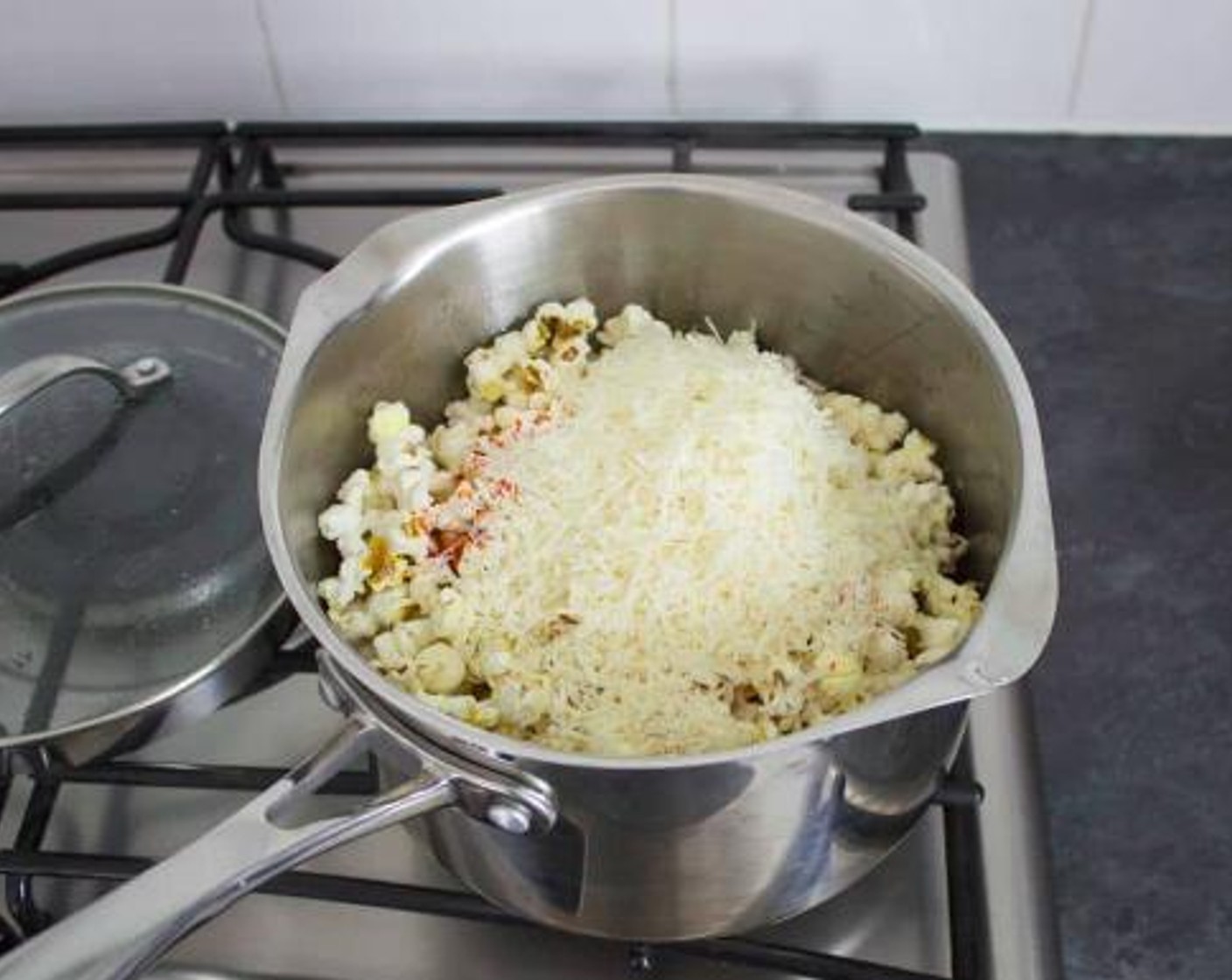 step 3 While it’s still hot, throw in the Simply Organic® Garlic Powder (1 tsp), Smoked Paprika (1/2 tsp), Parmesan Cheese (3/4 cup), and a little Salt (to taste) and Simply Organic® Black Pepper (to taste). Give it a quick mix then pop the lid back on to allow the cheese to melt.