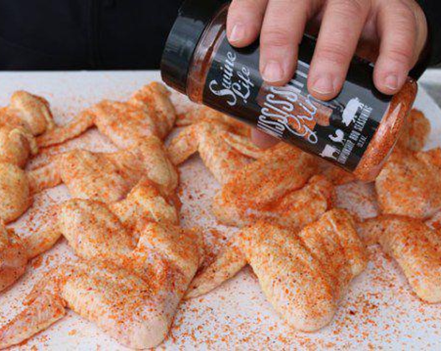 step 2 Remove Chicken Wings (3 lb) from the packaging and season with Barbecue Rub (1/2 cup) on all sides.