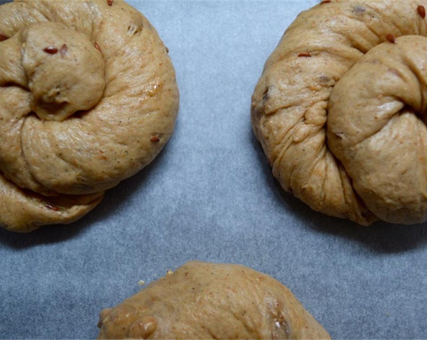 step 8 Now take each long cigar shaped dough and twist it a bit, then roll it into itself to make the classic shape. Place the rolls on a tray lined with parchment paper. Brush with Egg (1) and sprinkle with Sesame Seeds (to taste). Place in oven for 30 minutes.