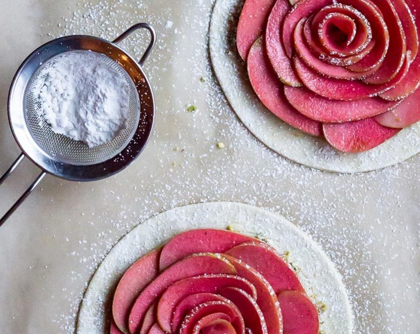 step 11 Sift each tart with Powdered Confectioners Sugar (1 Tbsp) and then bake the tarts on the centermost racks of the oven for 20 minutes, rotating the baking sheets 1/2 way through.