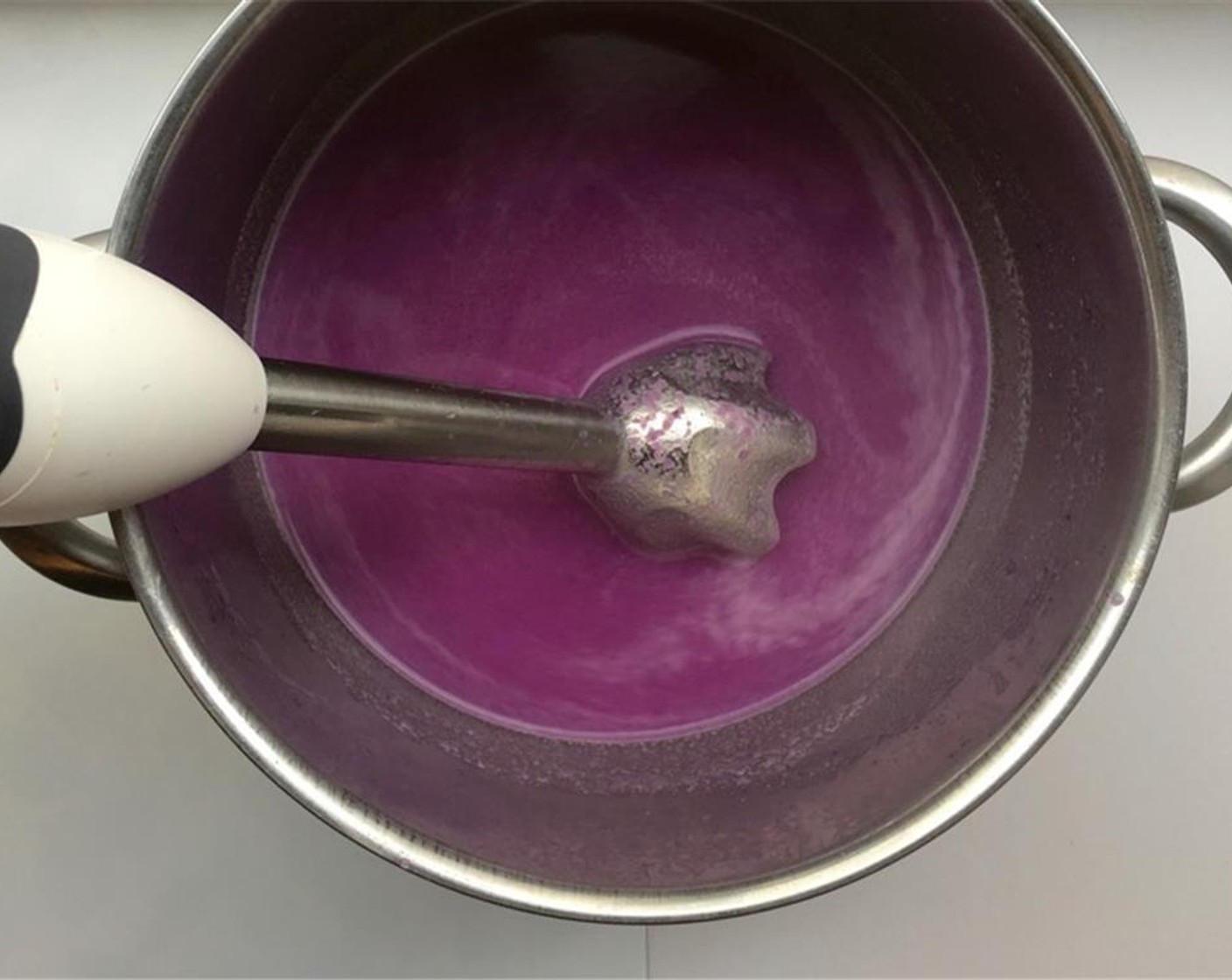step 6 Cook the remaining red cabbage in the hot stock for another 3 minutes. Then blend it well using a stick mixer until smooth (or use a blender). Add the red cabbage you kept aside back to the pan and stir well.