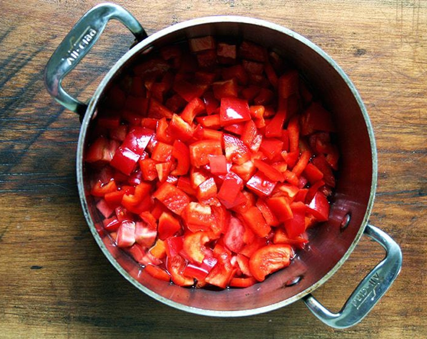 step 1 Place Red Bell Peppers (2) and Beefsteak Tomatoes (2) in a medium-sized saucepan or pot. Pour in Water (1/2 cup) and turn the heat to high. Season with Kosher Salt (1 tsp) and Freshly Ground Black Pepper (1 tsp). Bring to a simmer, then turn heat down to medium-high. Set a timer for 25 minutes.