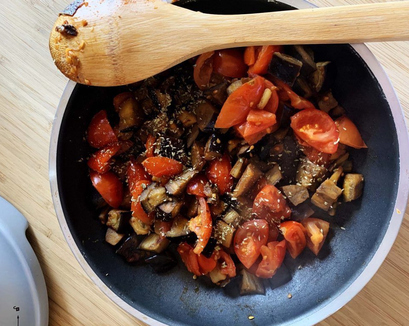 step 5 Cut Tomatoes on the Vine (8) in halves and add them to the skillet. Season with Salt (to taste), Ground Black Pepper (to taste), and Dried Oregano (1 tsp). Cook on medium until tomatoes release their water and soften up.