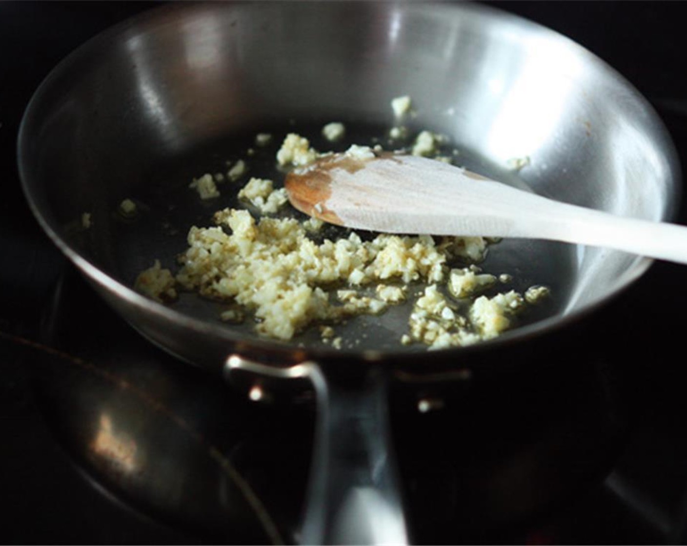 step 2 Heat Olive Oil (1 Tbsp) in a small frying pan over medium heat. When hot, add the minced garlic and saute for 3-4 minutes stirring frequently, until the garlic is a light golden color.