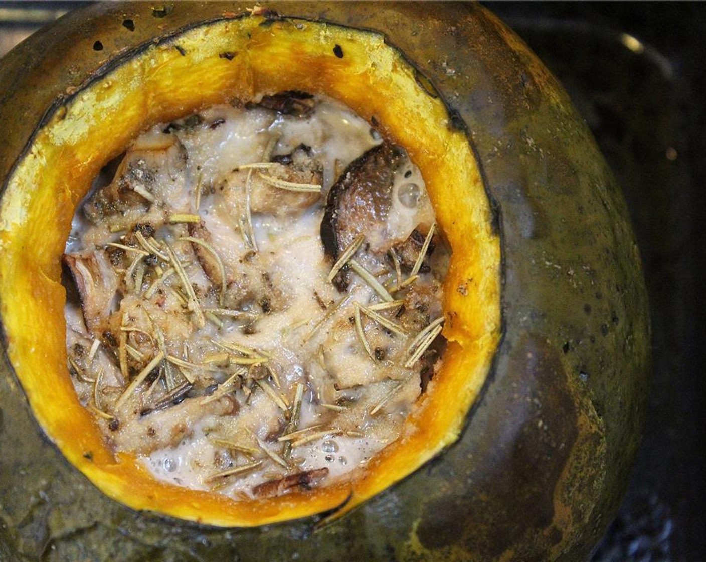 step 9 When the pumpkin is finished, let it sit while you wilt the Fresh Spinach (2 cups) with the minced garlic and Lemon (1/2) in a saute pan over medium heat.