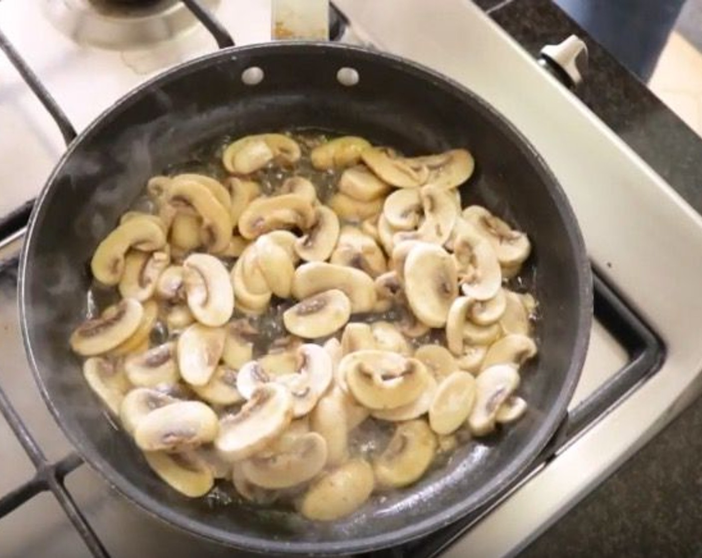step 10 Add the sliced mushrooms into the oil and mix. Cook for about 3-4 minutes, then season with Sea Salt (to taste) and Ground Black Pepper (to taste).
