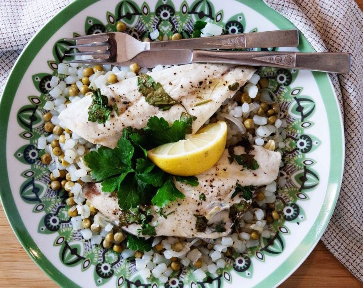 step 6 Place the rice onto a serving plate, lay the fish fillet on top, then drizzle over some extra olive oil and squeeze some fresh Lemon (1/4). Enjoy!