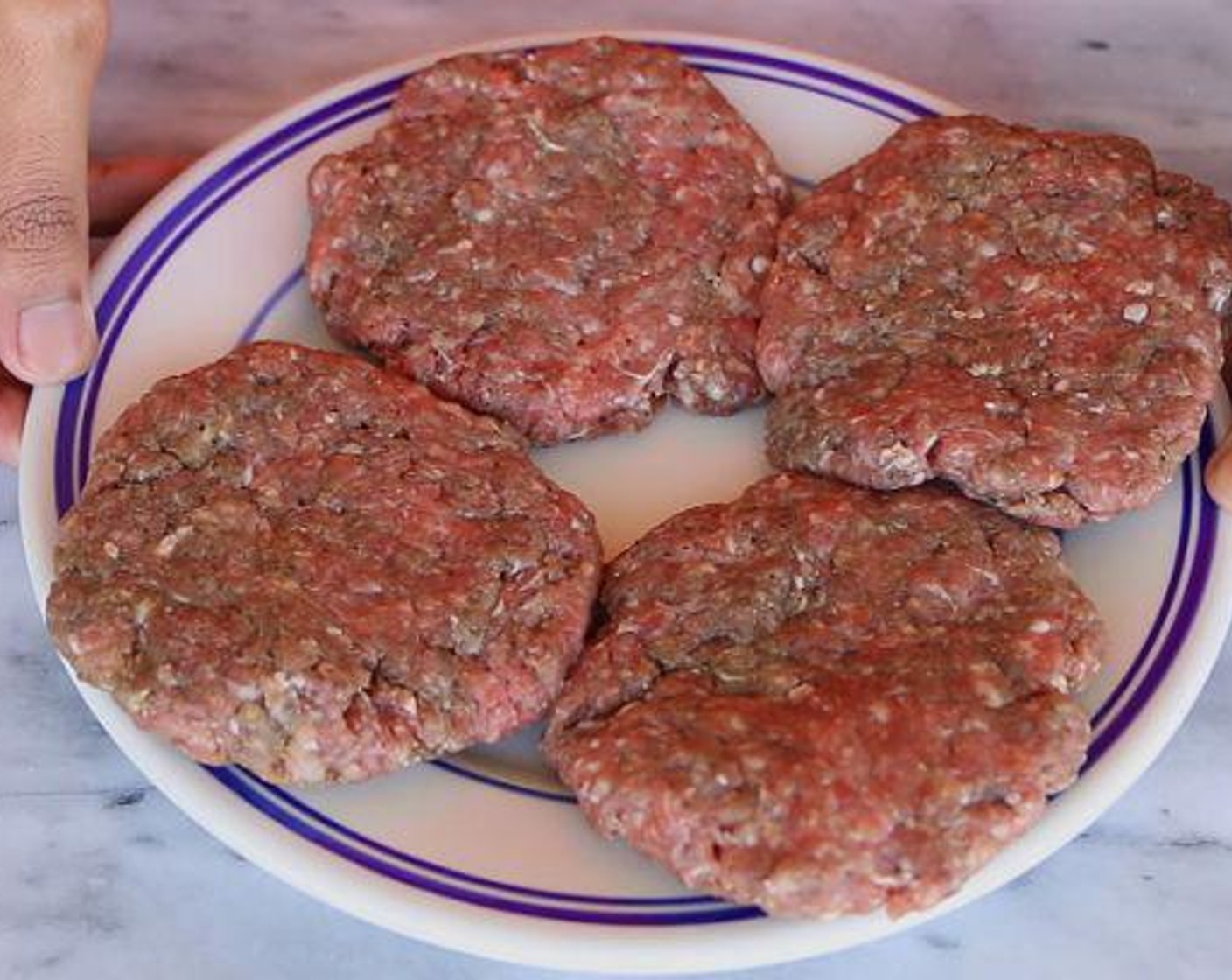 step 3 Divide the meat into 4 portions and form each portion into a patty. Cook the patties in the reserved bacon grease for 5-6 minutes.