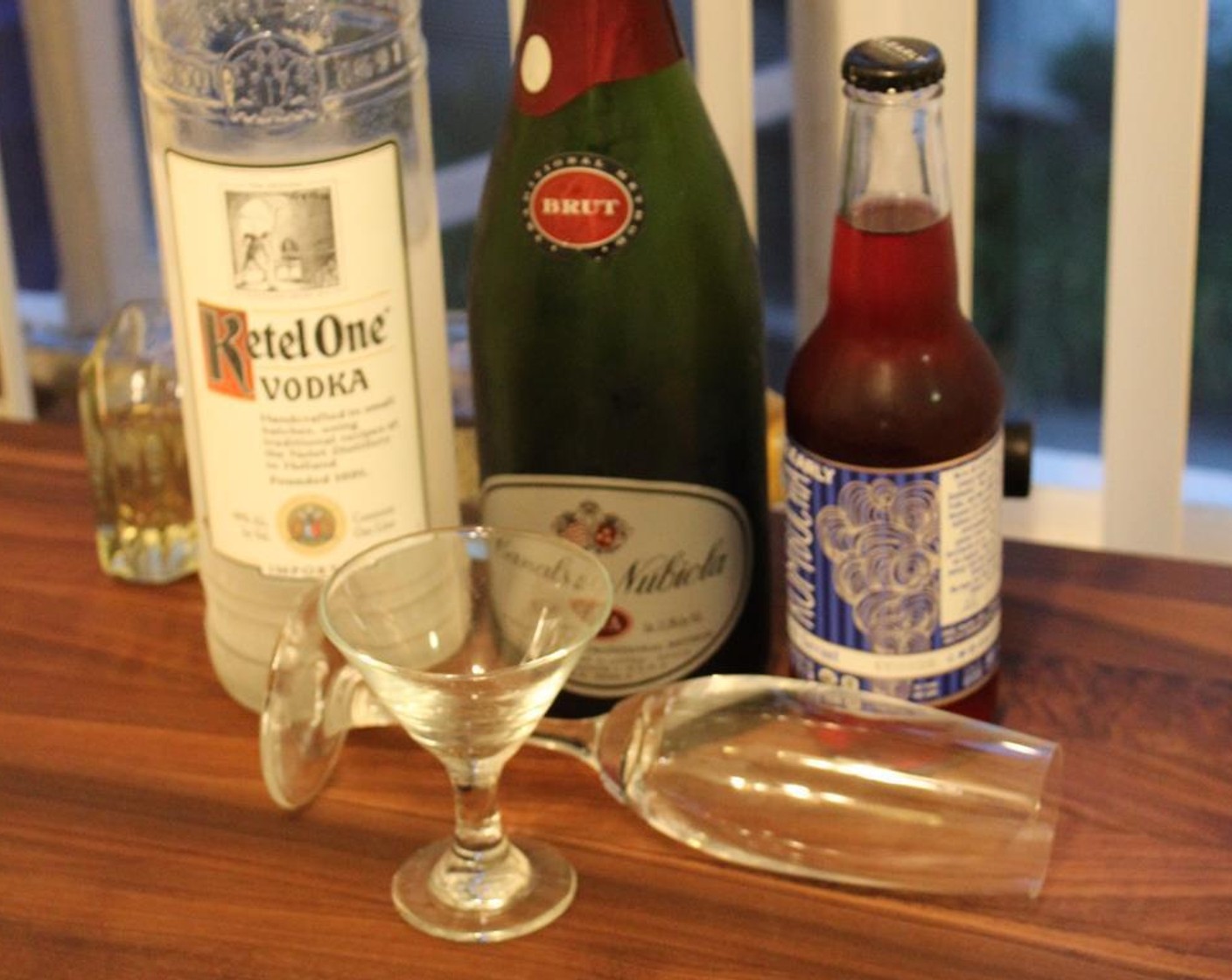 step 1 In a mixing glass, add the Clearly Kombucha Black Currant (8 fl oz), Champagne (4 fl oz), GREY GOOSE® Vodka (1 fl oz) and Elderflower Liqueur (1 fl oz) and stir together.