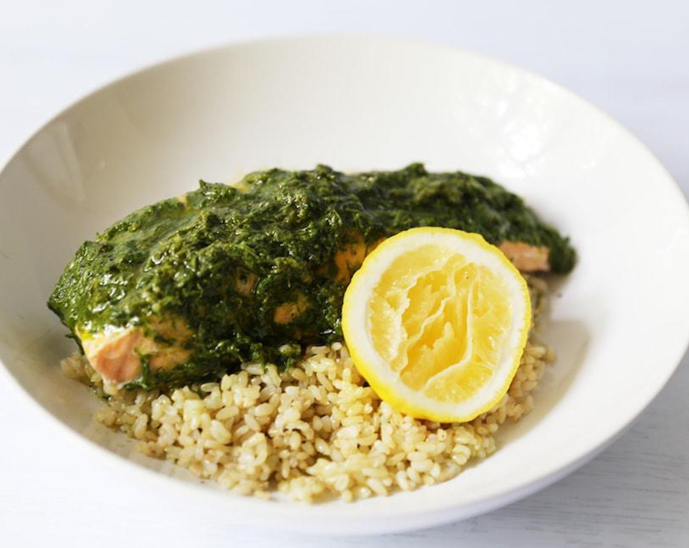 step 6 Serve the salmon with the brown rice, topped with the herb sauce. Enjoy!