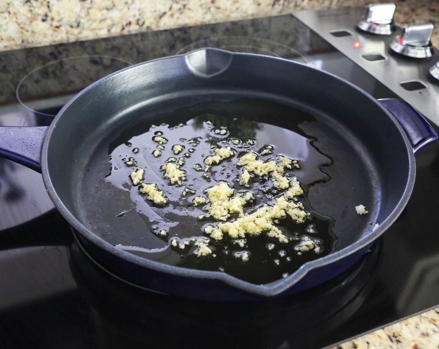step 1 Heat Olive Oil (1/4 cup) in a cast-iron skillet over medium-high heat. Add Garlic (4 cloves) and cook, stirring frequently, for 3 minutes.