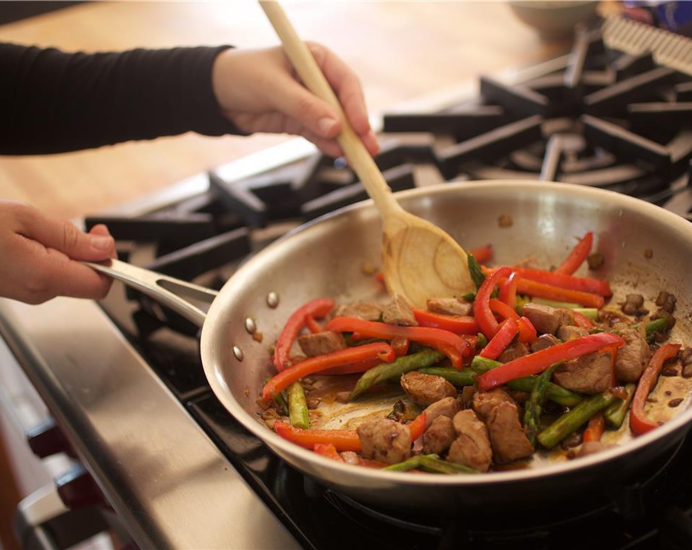 step 12 Add the bell pepper and asparagus and cook for an additional three minutes.