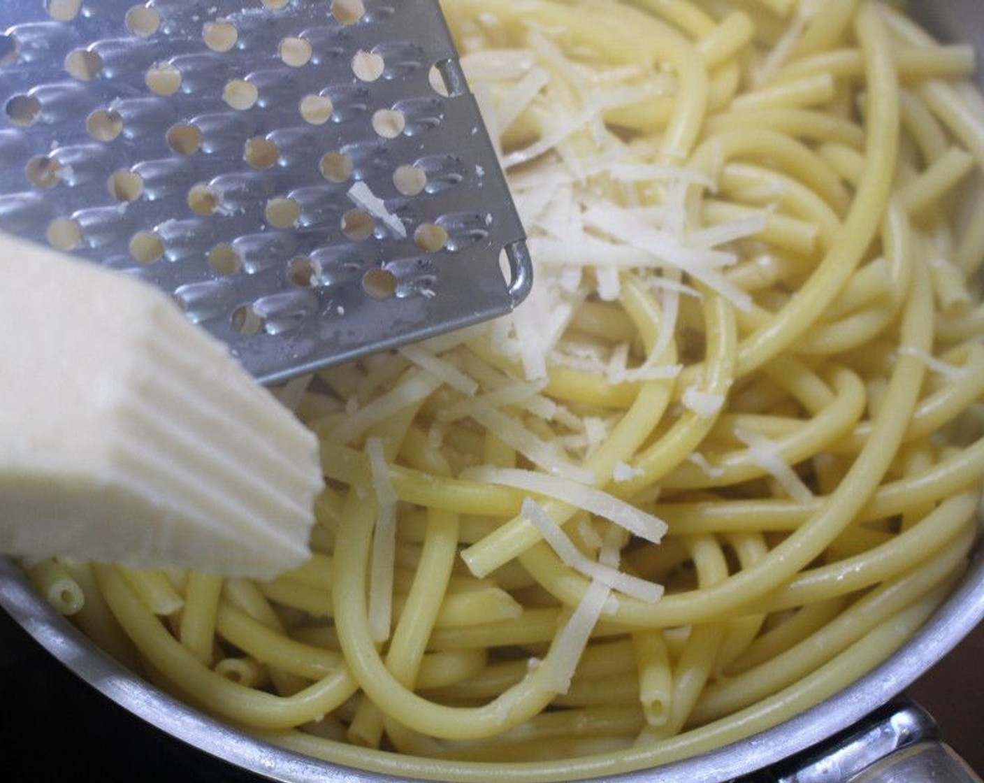 step 5 Drain the pasta, then mix with Extra-Virgin Olive Oil (2 Tbsp) and Parmigiano-Reggiano (2 Tbsp). Plate on a deep pasta plate.