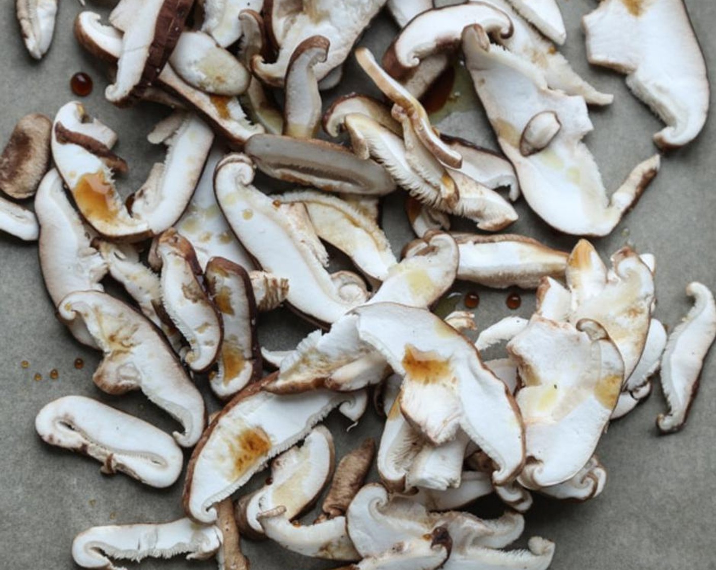 step 2 On a parchment-lined baking sheet, toss the Shiitake Mushrooms (1 1/2 cups) with the Olive Oil (1/2 Tbsp) and Gluten-Free Tamari Soy Sauce (1/2 Tbsp).