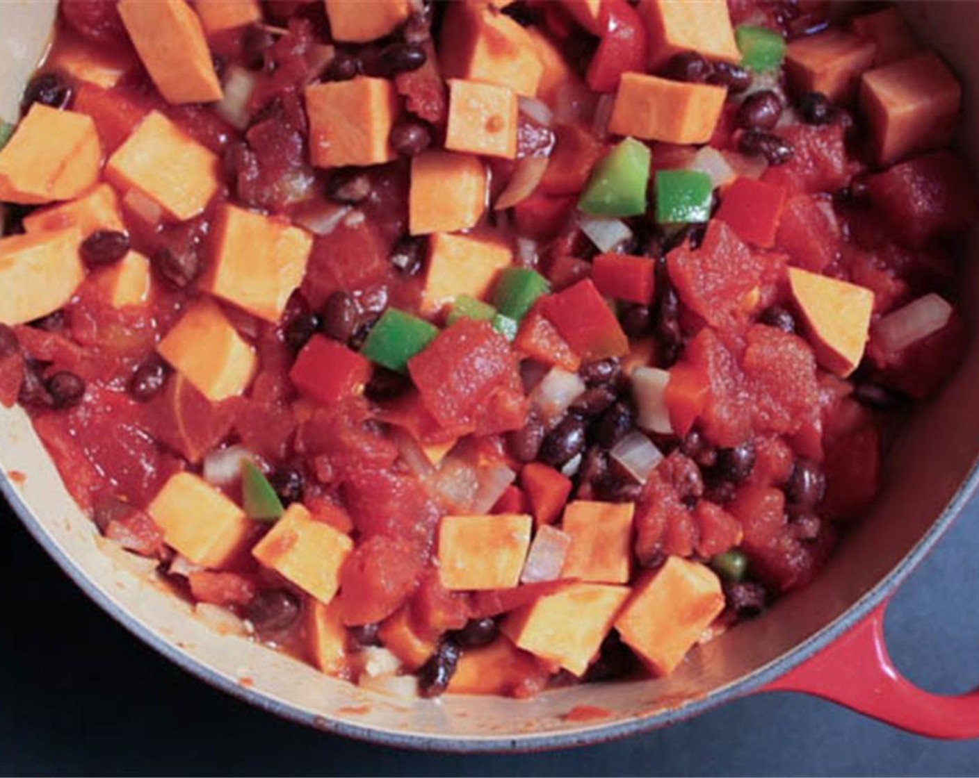 step 3 Add the Sweet Potato (1), Black Beans (1 can), Fire Roasted Diced Tomatoes (1 can), Hot Sauce (to taste) and Vegetable Stock (1 cup).